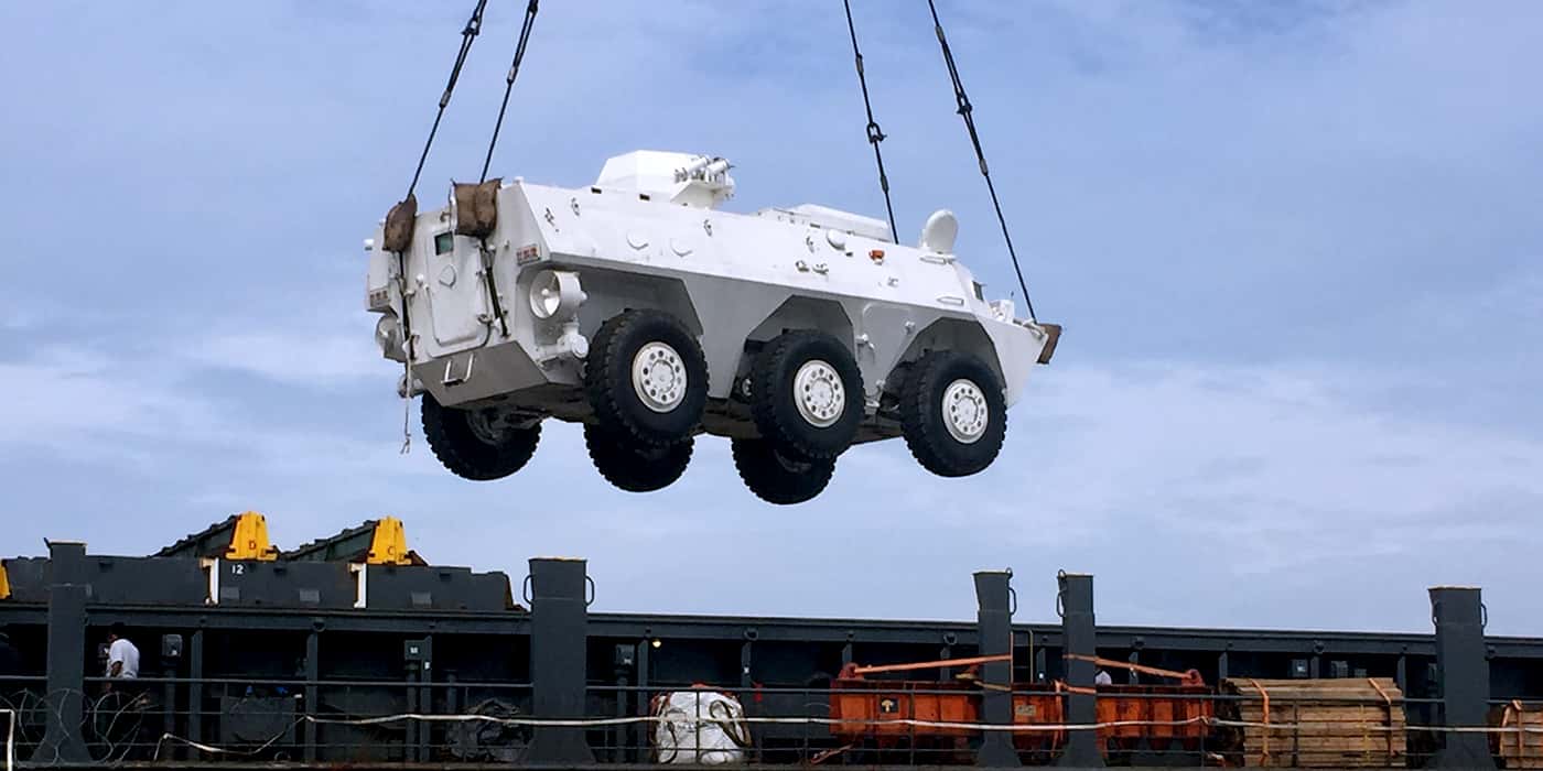 Heavy equipment logistics lift operation